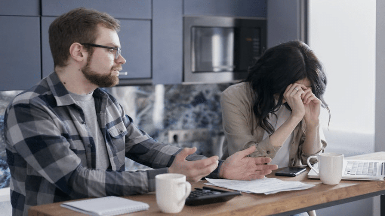 A woman crying while her husband talks