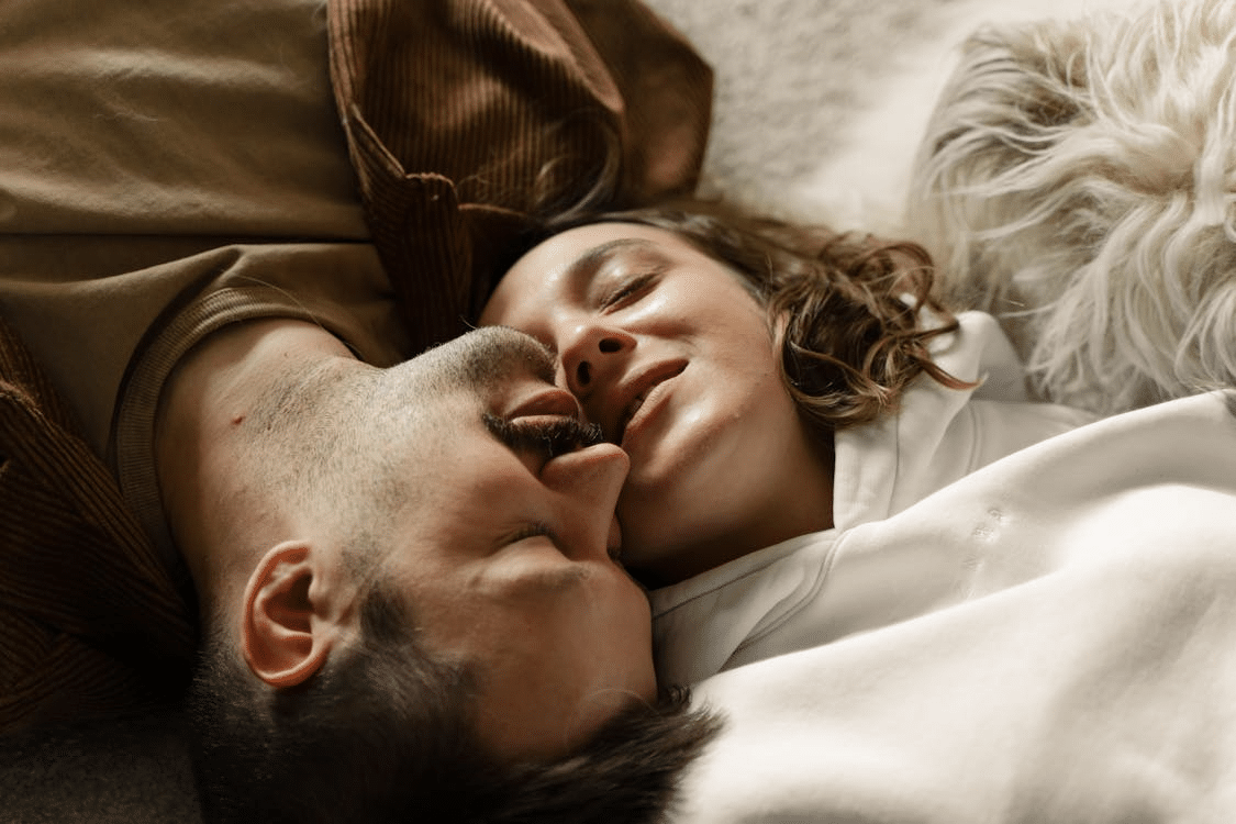 A couple lying on the bed