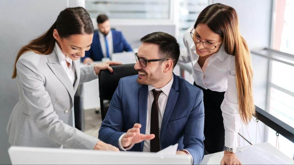 A man being flirty with his colleagues