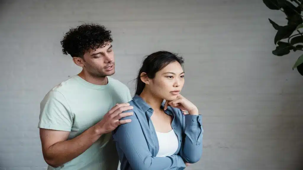 A couple talking indoors 