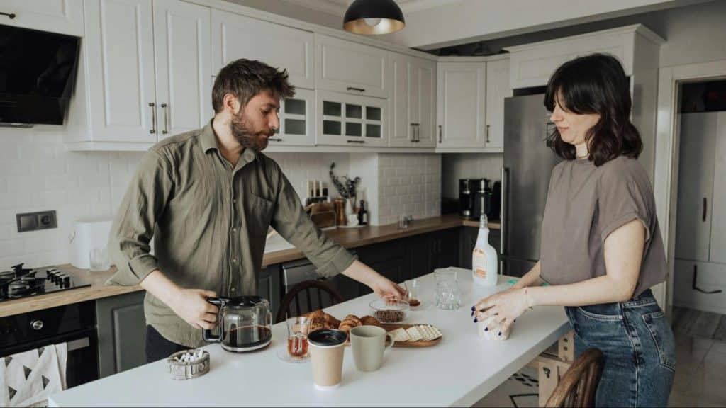 A man and woman at the kitchen