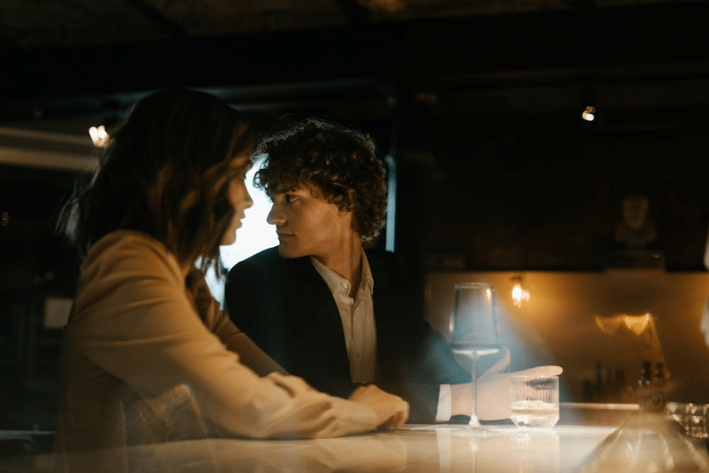 A man and a woman at a bar
