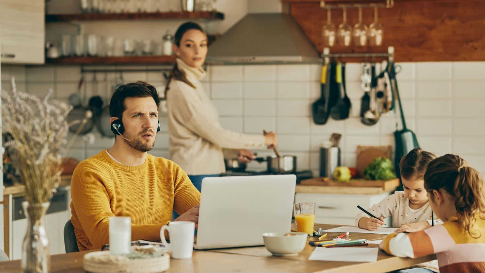 A man busy working and a woman looking at him