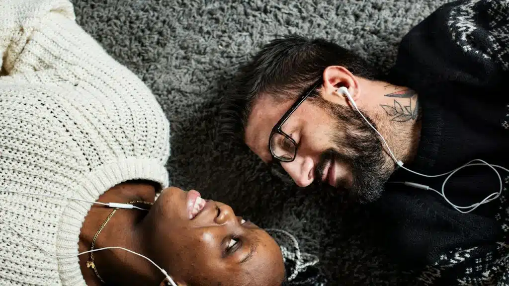 A couple listening to music together.