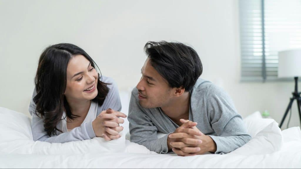A man and woman smiling at each other