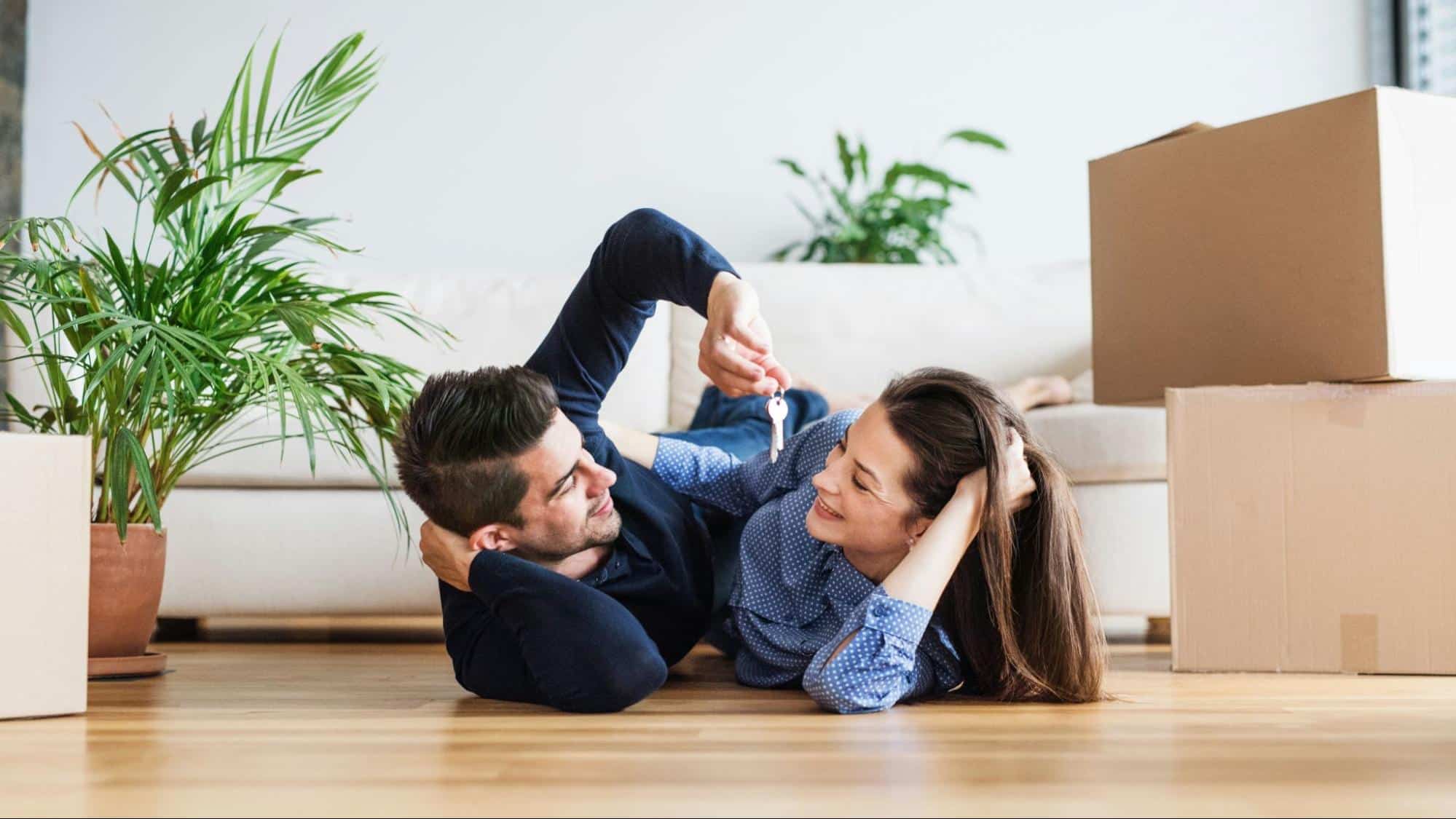 A man and woman laying on the floor