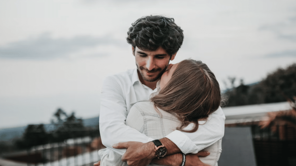 A couple hugging outdoors