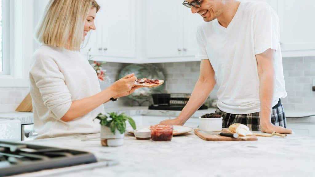 A woman making her husband a toast