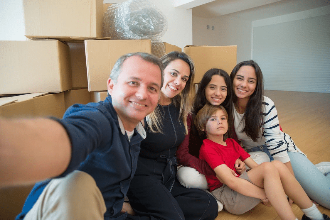 A family sitting on the floor