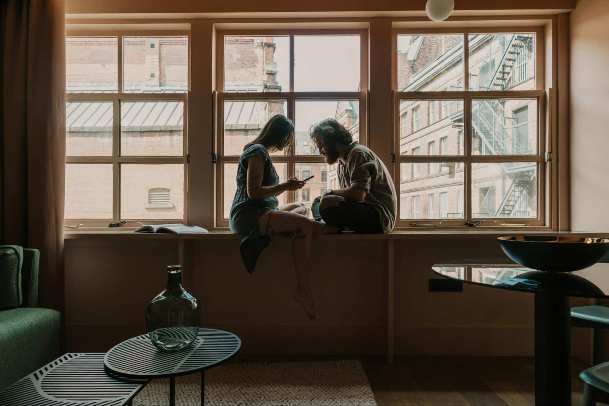 A man and woman at the window
