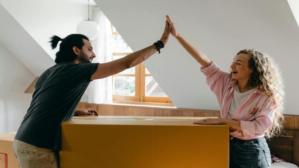A couple high fiving each other