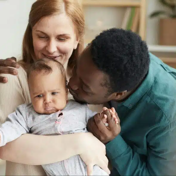 A man and woman with their baby
