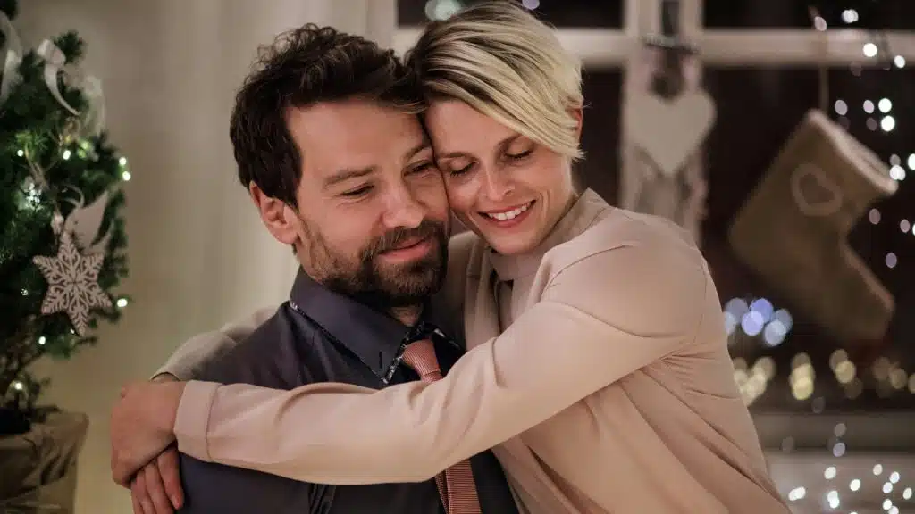 A happy couple hugging.