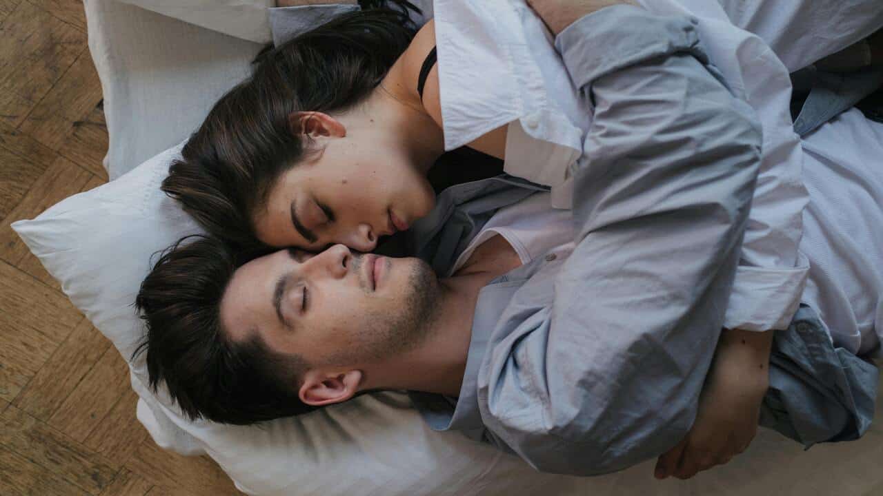 A couple cuddling at home