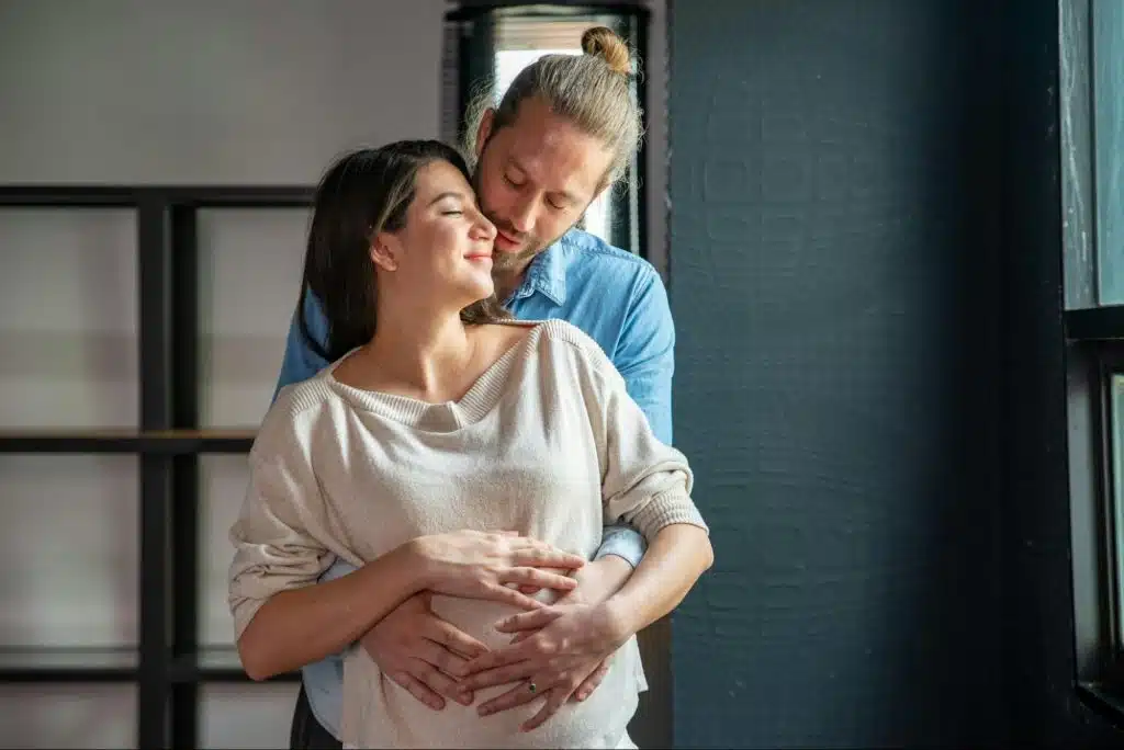 A man hugging a woman