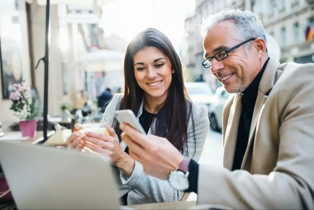 A man showing something to to woman