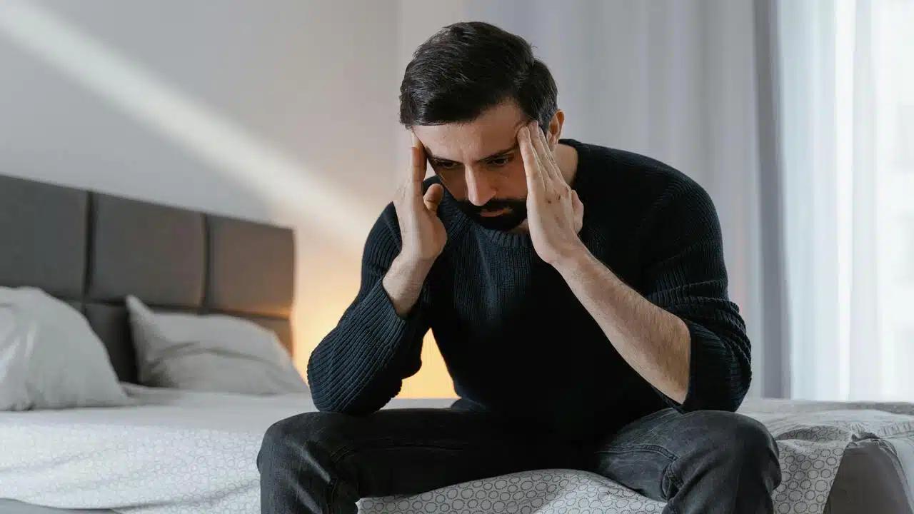 A man looking sad at home