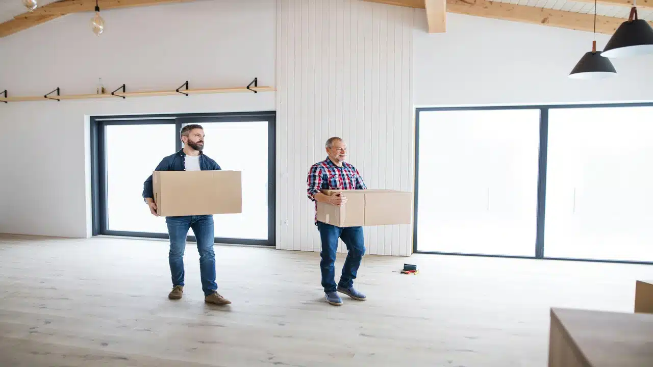 A man helping his father move