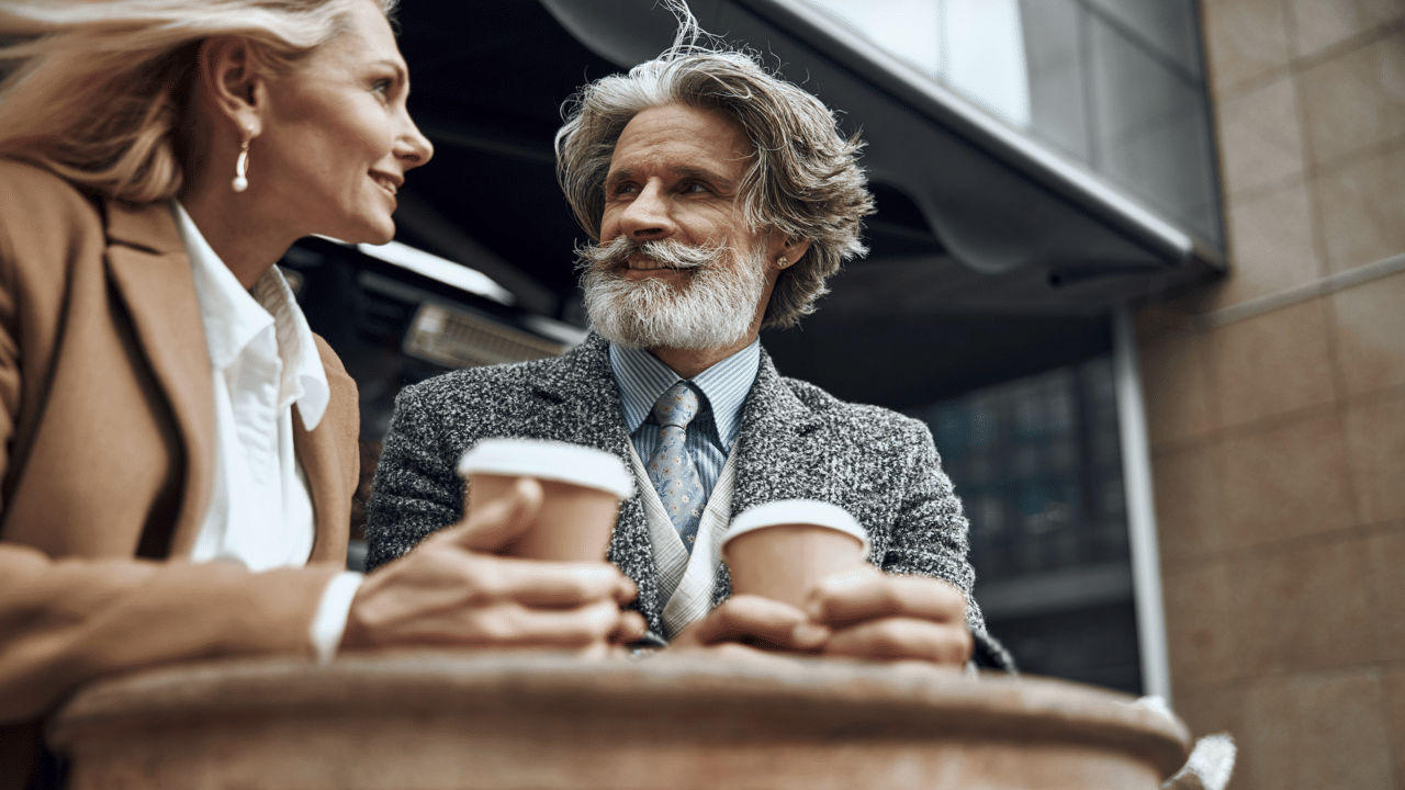A beautiful mature couple having coffee together