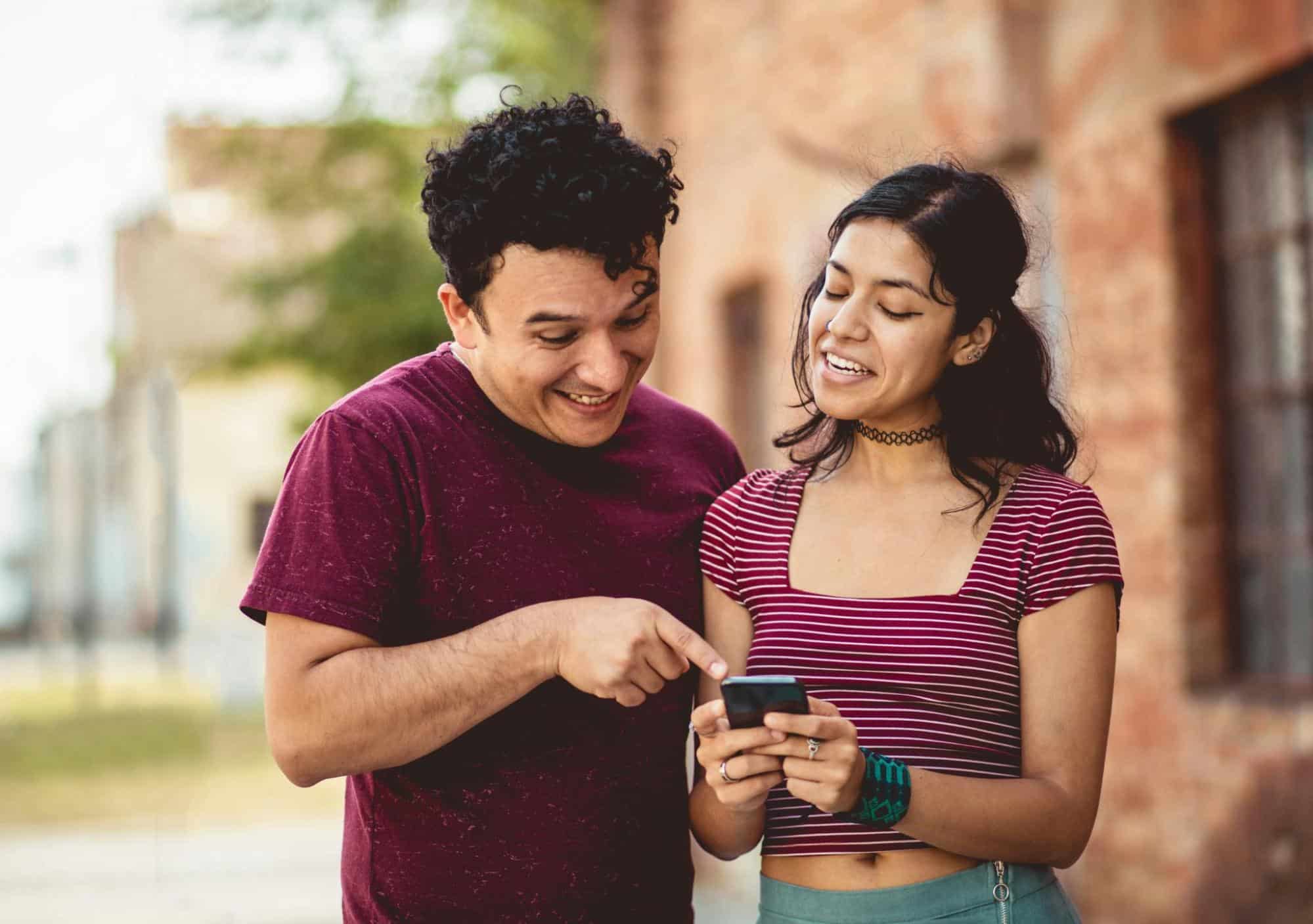 A woman showing something to a man