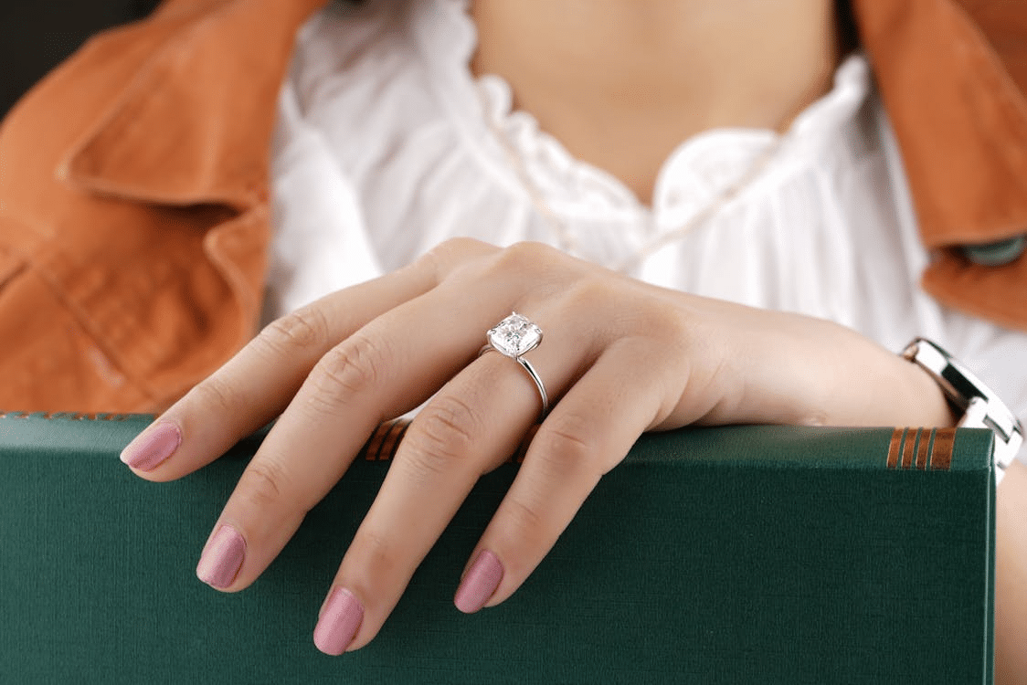A woman wearing a diamond ring