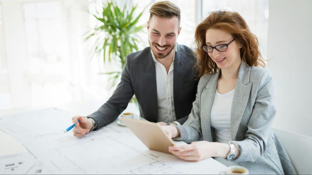 A man and woman together while at the office