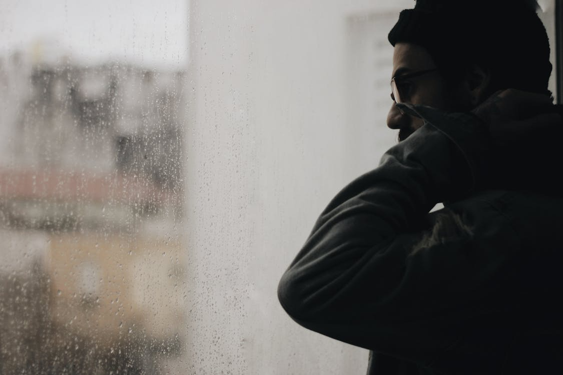 A man standing by the window