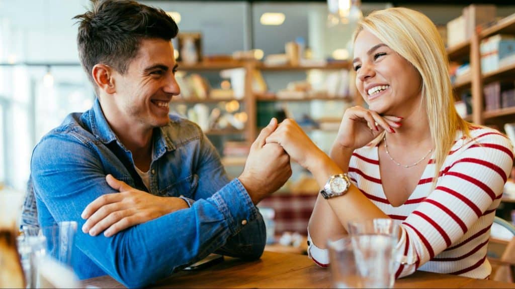 A man and woman smiling