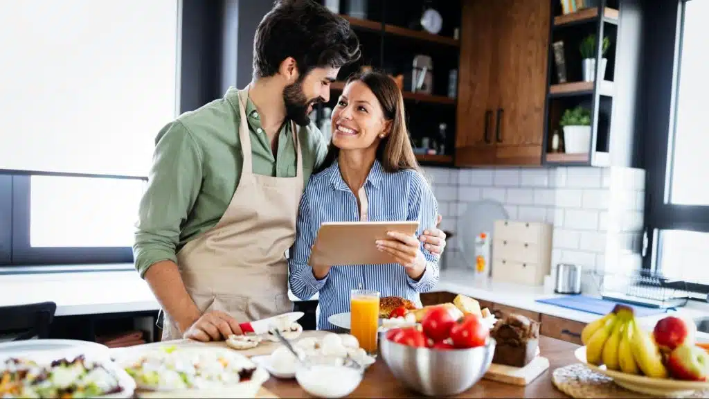 A man and woman at the kitchen