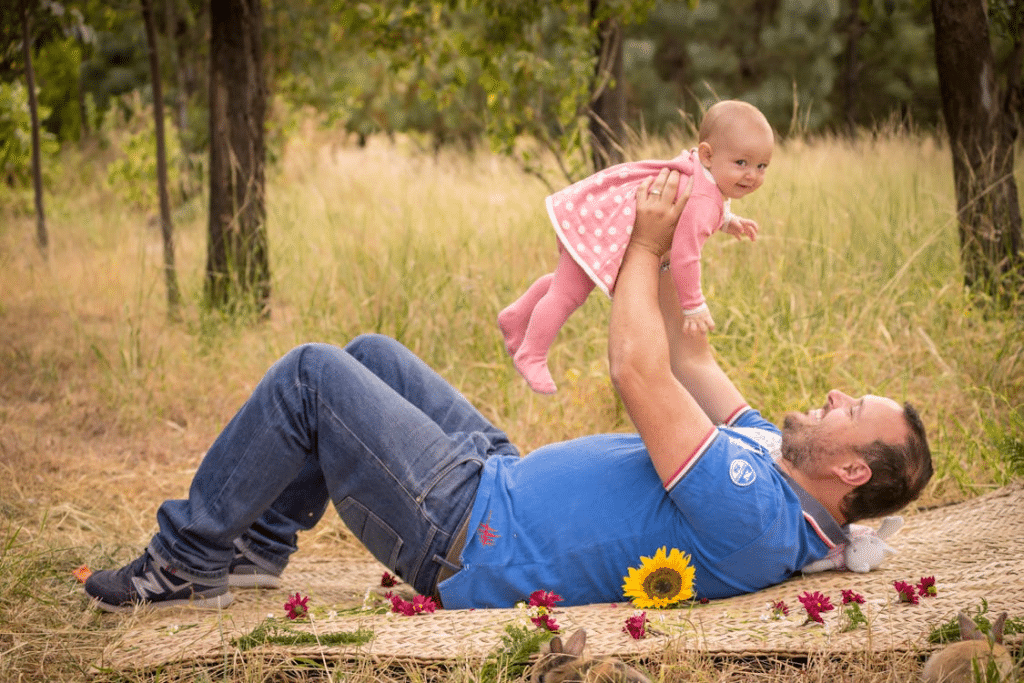 A man playing with a child