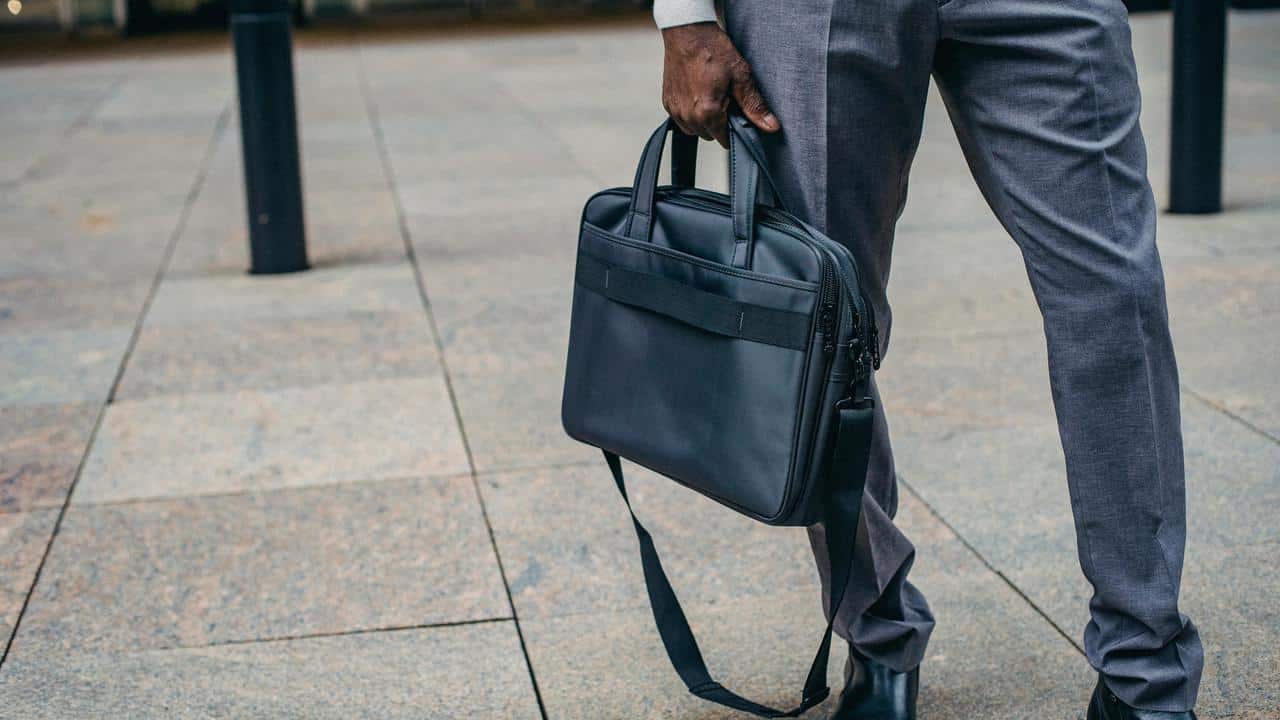 A person holding a briefcase.