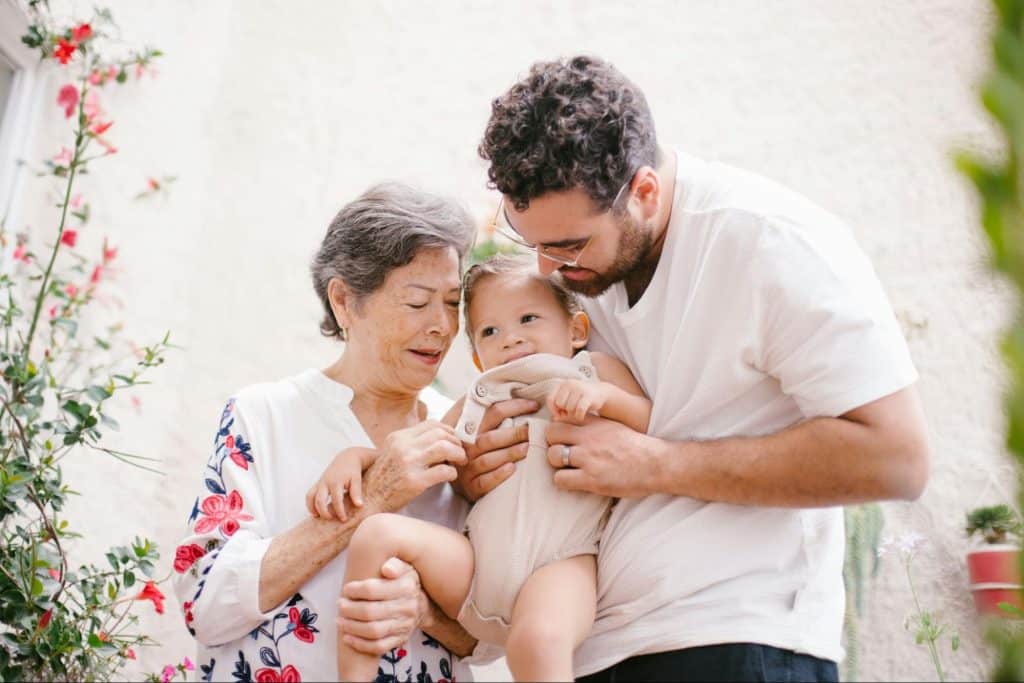 Grandmother, father and the baby