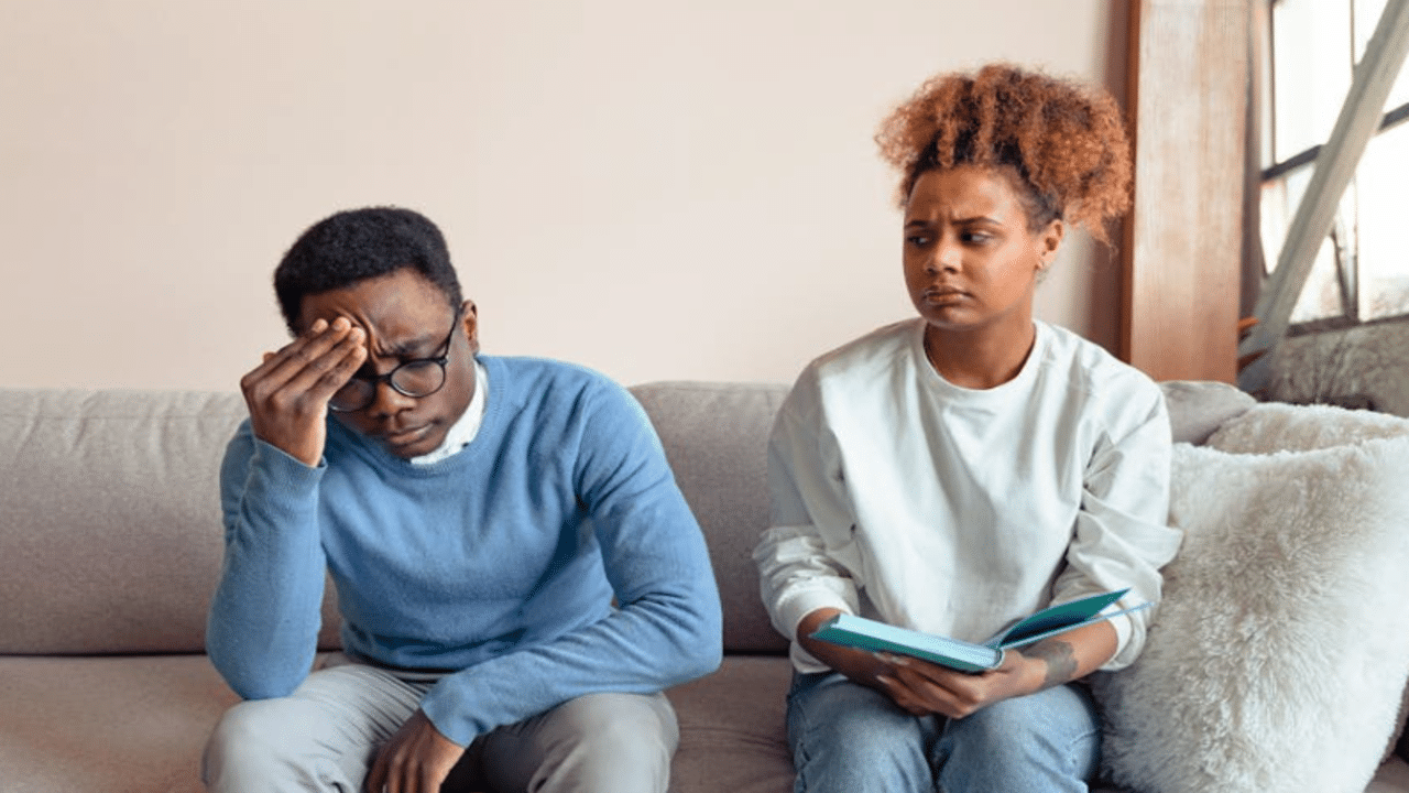 A couple frowning in therapy
