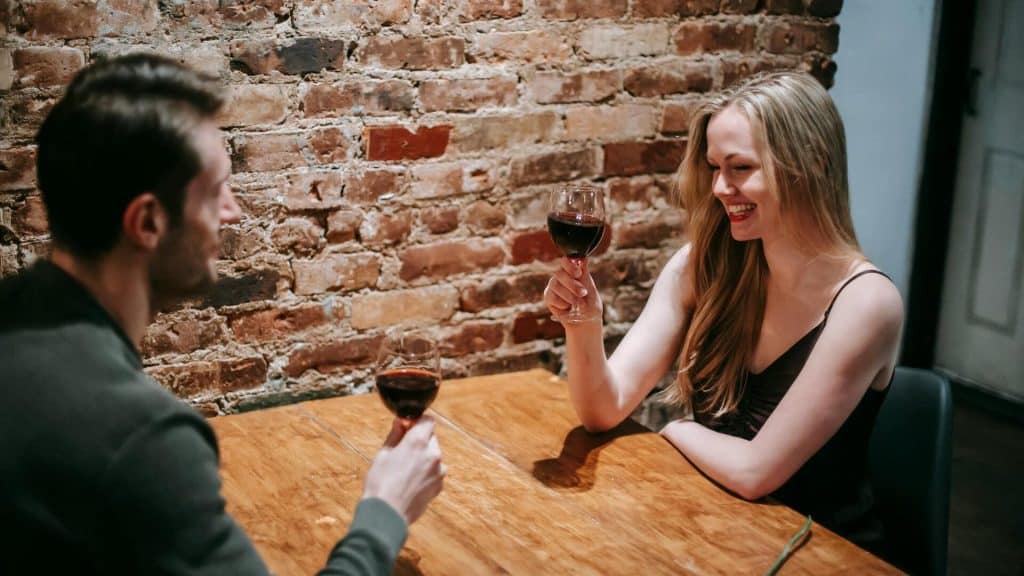 A couple drinking wine during a date.