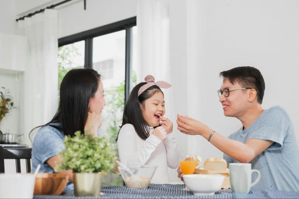 A man and woman with their child