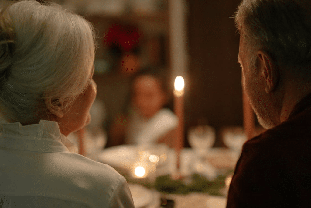 An elderly couple having dinner with family