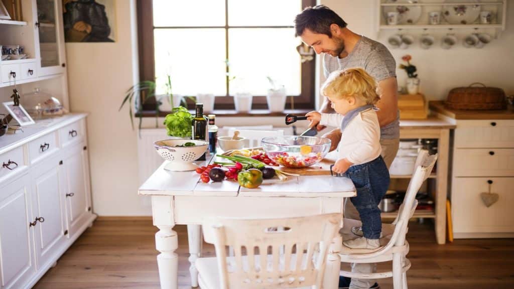 A man cooking with his son