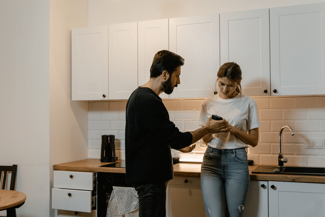 A man showing something to a woman