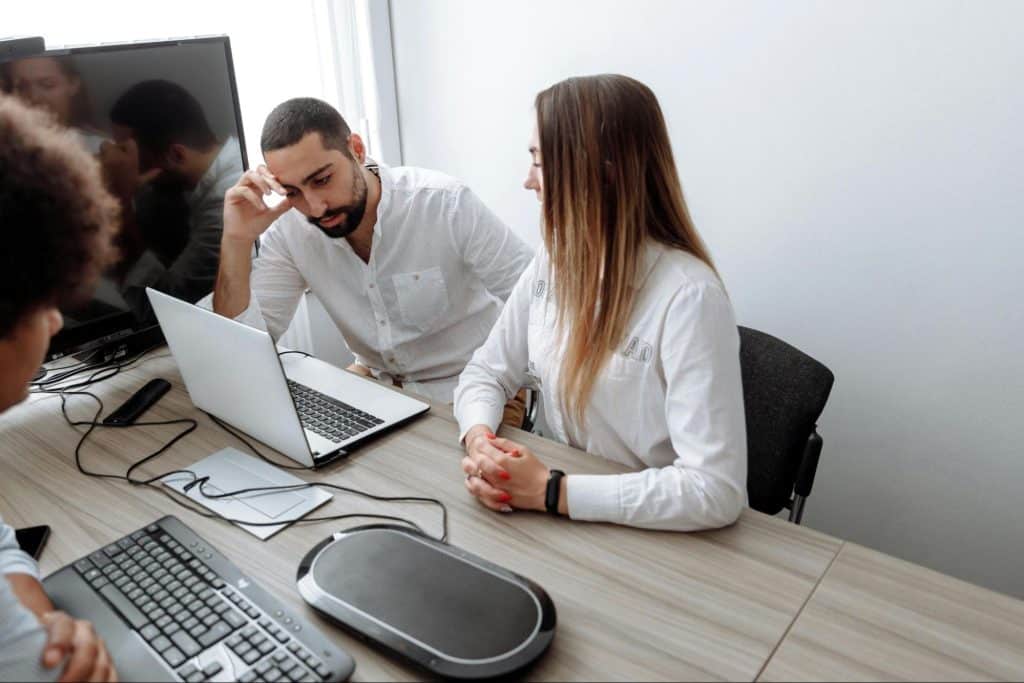 A woman talking to a man