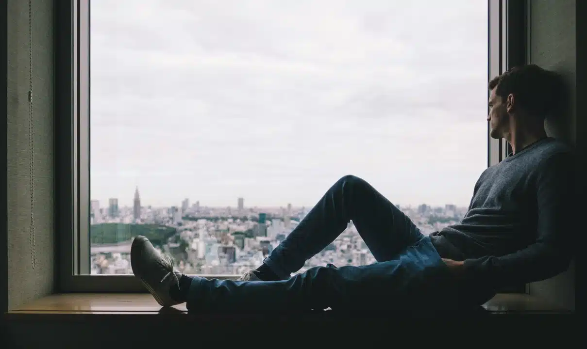 A man looking out the window