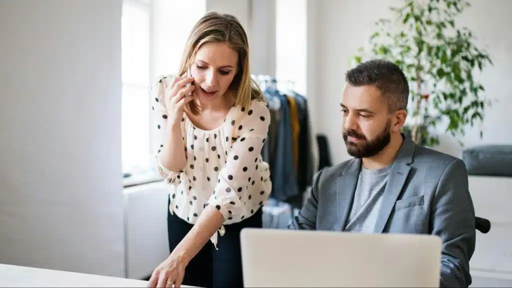 A woman helping a man