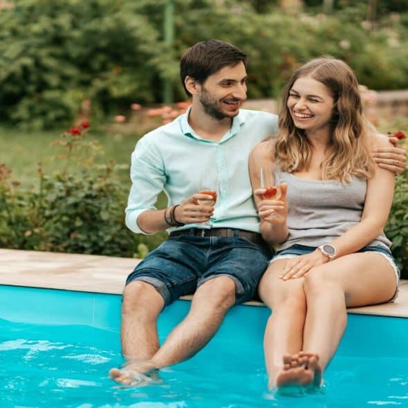 A couple wading in the pool