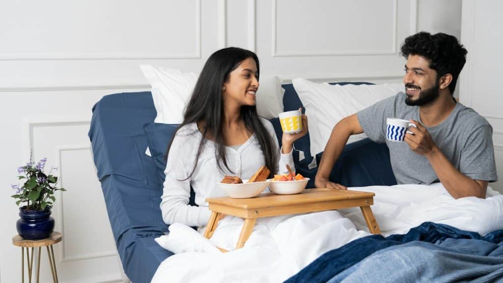 A man and a woman having breakfast together.