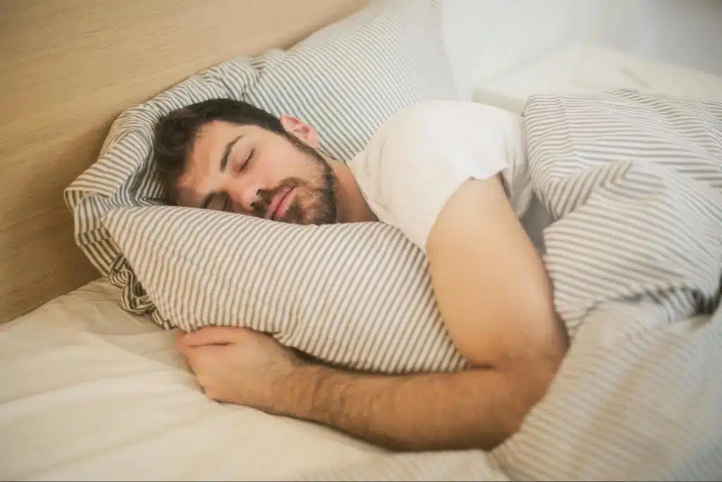 A man sleeping using an unchanged sheet
