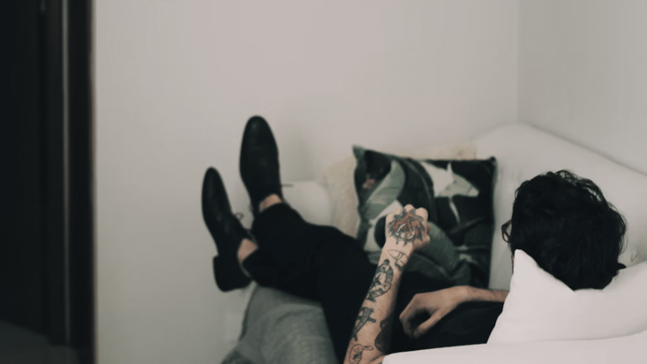 A man laying on the couch