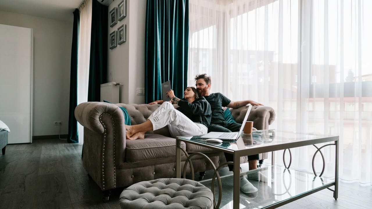 A couple reading together at home