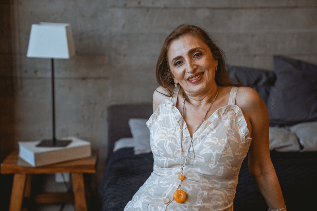 A woman in a dress smiling