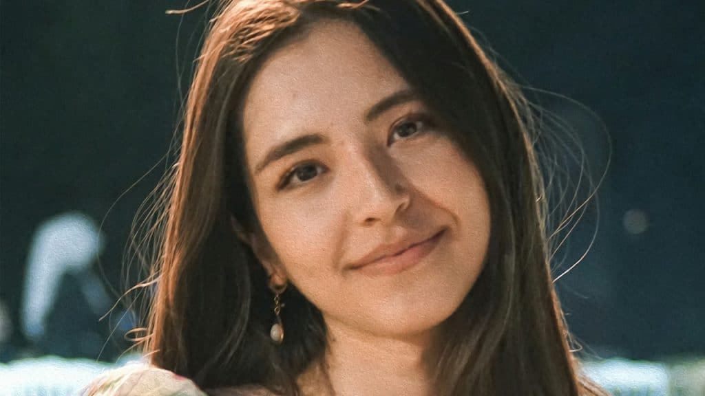 A woman smiling at the camera.
