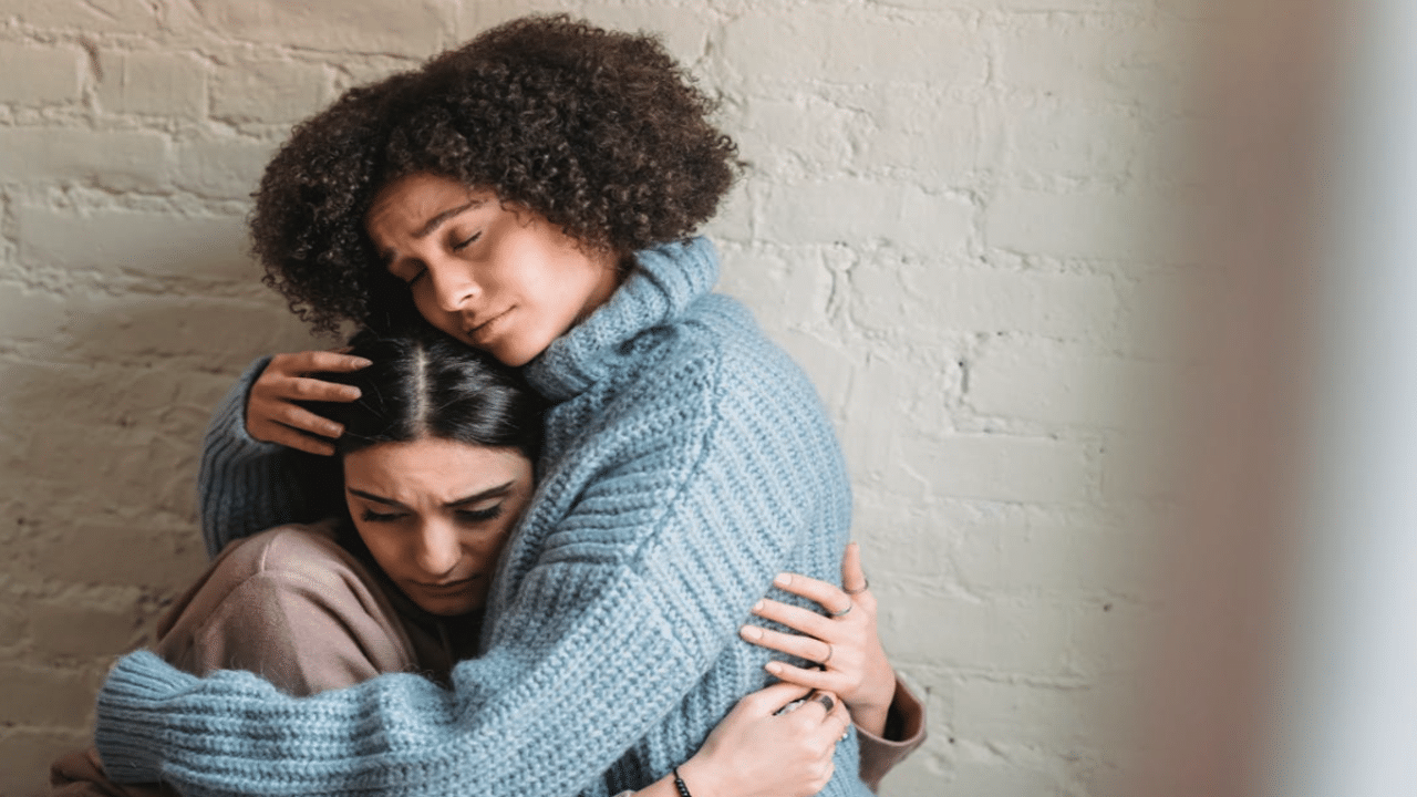 A woman comforting her upset friend