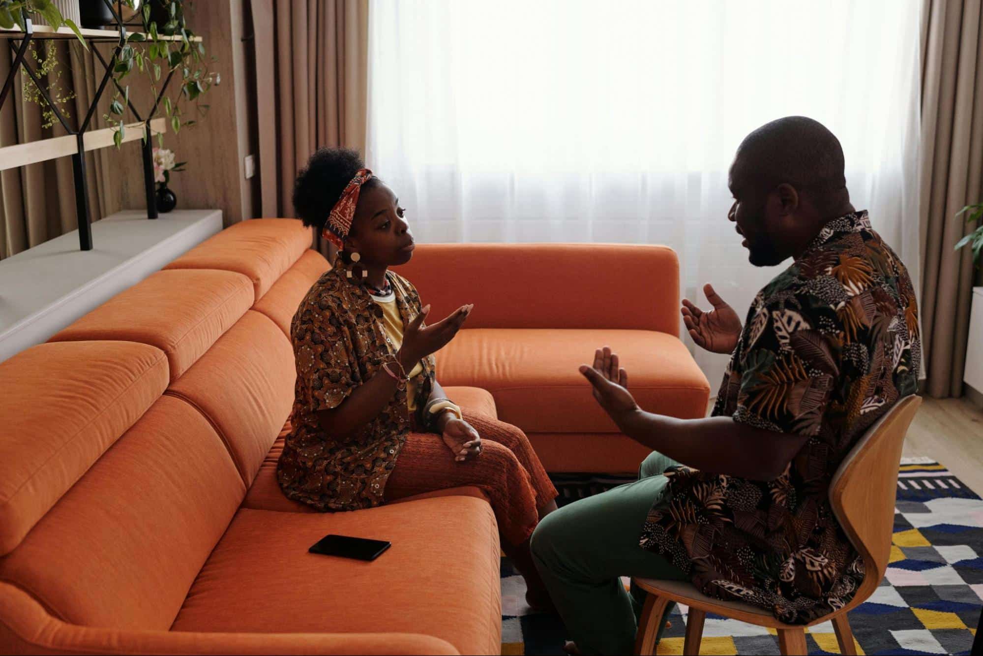 A man and woman facing each other while talking